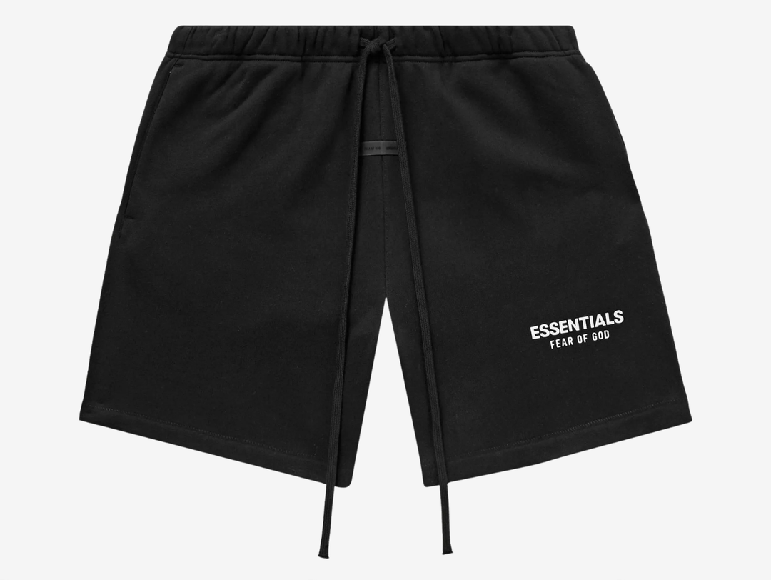 Looking for clean shorts that go with everything? Fear Of God Essentials Classic Shorts arrive in Jet Black with a relaxed cut and mid-length profile. Soft cotton-blend fleece, elastic waistband, and long drawcords lock in comfort, while side pockets keep your keys close. Minimal ESSENTIALS branding at the hem delivers that signature look. Perfect for gym runs, flights or off-duty days. Grab yours today.