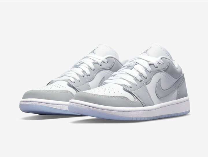 Timeless Air Jordan 1 Low sneakers in a classic grey and white colour scheme.