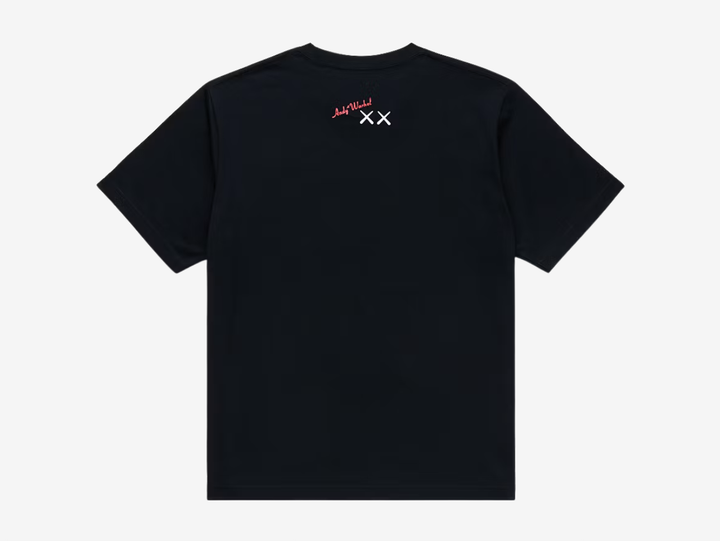Black crewneck T-shirt with a white UT logo on the chest label, featuring a white line-art print of a KAWS Companion figure standing beside a boxy robot character, both in a sketchy hand-drawn style, centered on the chest.
