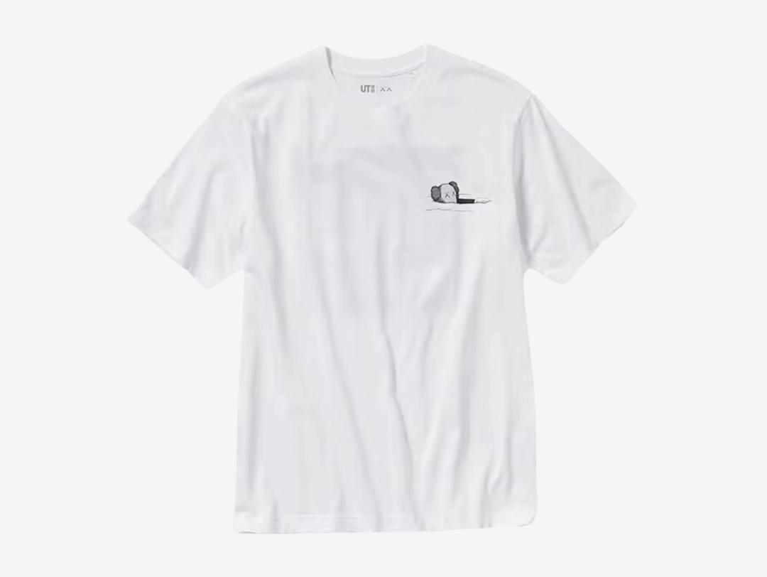 The KAWS x Uniqlo UT Short Sleeve Artbook Cover T-Shirt (US Sizing) White is a collaborative top from the UT lineup released as part of the Fall/Winter 2023 ‘FW23’ collection.

This KAWS x Uniqlo t-shirt is available in white and has a short-sleeved round neck design. The highlight of this tee is the different versions of KAWS artwork at the front and back. The front features a one-pointed companion floating on the surface, while the back features a print of KAWS' new art book cover design.