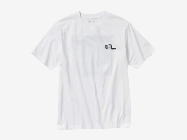 The KAWS x Uniqlo UT Short Sleeve Artbook Cover T-Shirt (US Sizing) White is a collaborative top from the UT lineup released as part of the Fall/Winter 2023 ‘FW23’ collection.

This KAWS x Uniqlo t-shirt is available in white and has a short-sleeved round neck design. The highlight of this tee is the different versions of KAWS artwork at the front and back. The front features a one-pointed companion floating on the surface, while the back features a print of KAWS' new art book cover design.