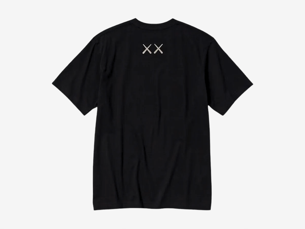 The KAWS x Uniqlo Graphic T-shirt in Black showcases one of KAWS' most recognisable Companion artworks with a large embroidered-style front graphic. Crafted from soft 100% cotton, it offers a comfortable everyday fit while combining clean, minimal styling with the artist's signature contemporary aesthetic. Perfect for collectors and fans of KAWS' iconic collaborations.