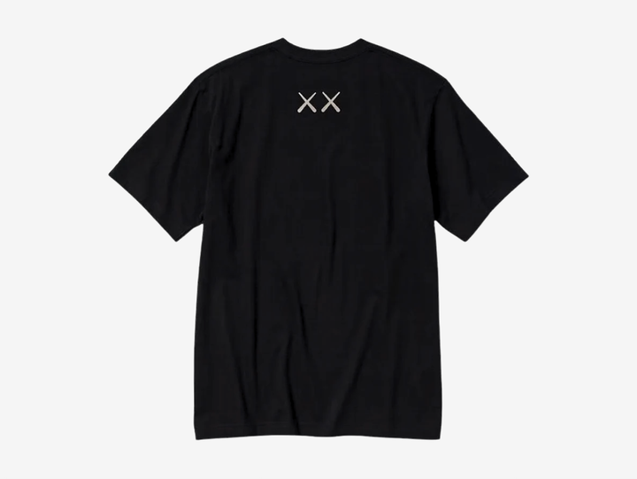 The KAWS x Uniqlo Graphic T-shirt in Black showcases one of KAWS' most recognisable Companion artworks with a large embroidered-style front graphic. Crafted from soft 100% cotton, it offers a comfortable everyday fit while combining clean, minimal styling with the artist's signature contemporary aesthetic. Perfect for collectors and fans of KAWS' iconic collaborations.