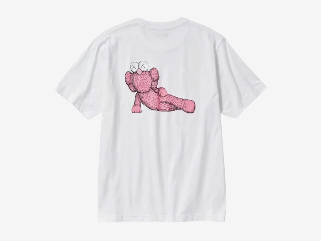 Released as part of the Fall/Winter 2023 (FW23) collection, the KAWS x Uniqlo UT Short Sleeve Graphic T-Shirt (US Sizing) White is a top from the KAWS UT pack celebrating the art book launch of KAWS.

This KAWS x Uniqlo tee is made of pure cotton and features a short-sleeved crewneck design. KAWS' signature ‘XX’ logo is printed on the front right chest in pink, while the back features artwork of the famous pink BFF character. UT x XX collaborative branding details on the woven neck tag round out the design.
