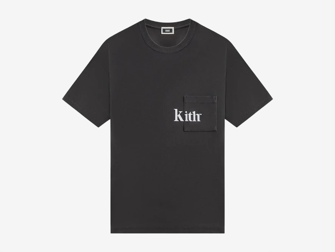 The Quinn Tee is crafted of 265 GSM cotton jersey that is washed for a soft hand feel. It features a ribbed neckline, patch pockets at the chest with flocked Kith artwork, and slit at the seams.