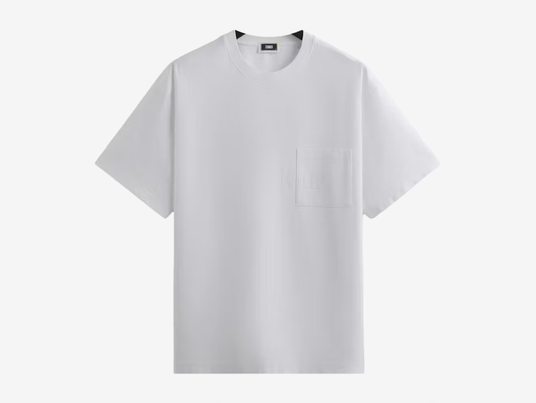 he Kith Quinn Tee is made from a premium 280GSM cotton fabric, garment dyed and washed for a high-low color effect. It has Kith serif branded artwork printed across the left chest, and slit detailing at the side seams.