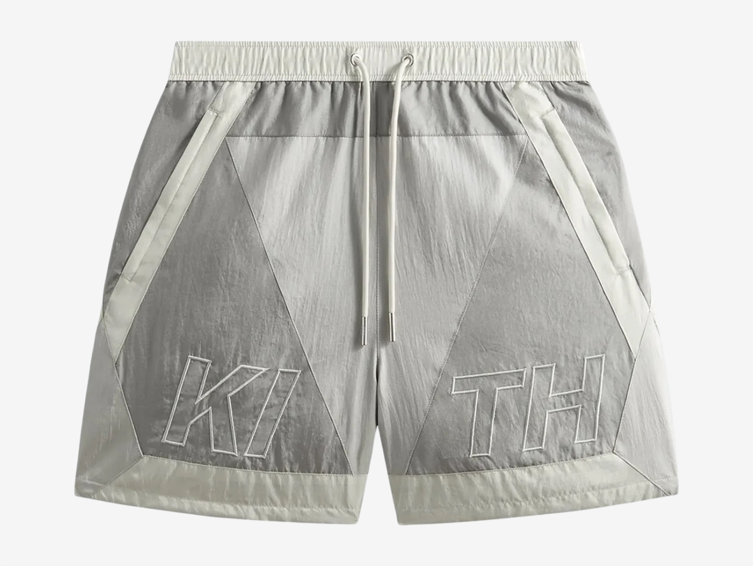 Kith Washed Nylon Shorts in Pacify, crafted from lightweight washed nylon with a relaxed fit, elasticated waistband, and functional pocket detailing. Finished in a soft blue-grey colourway with signature Kith branding for effortless everyday wear.