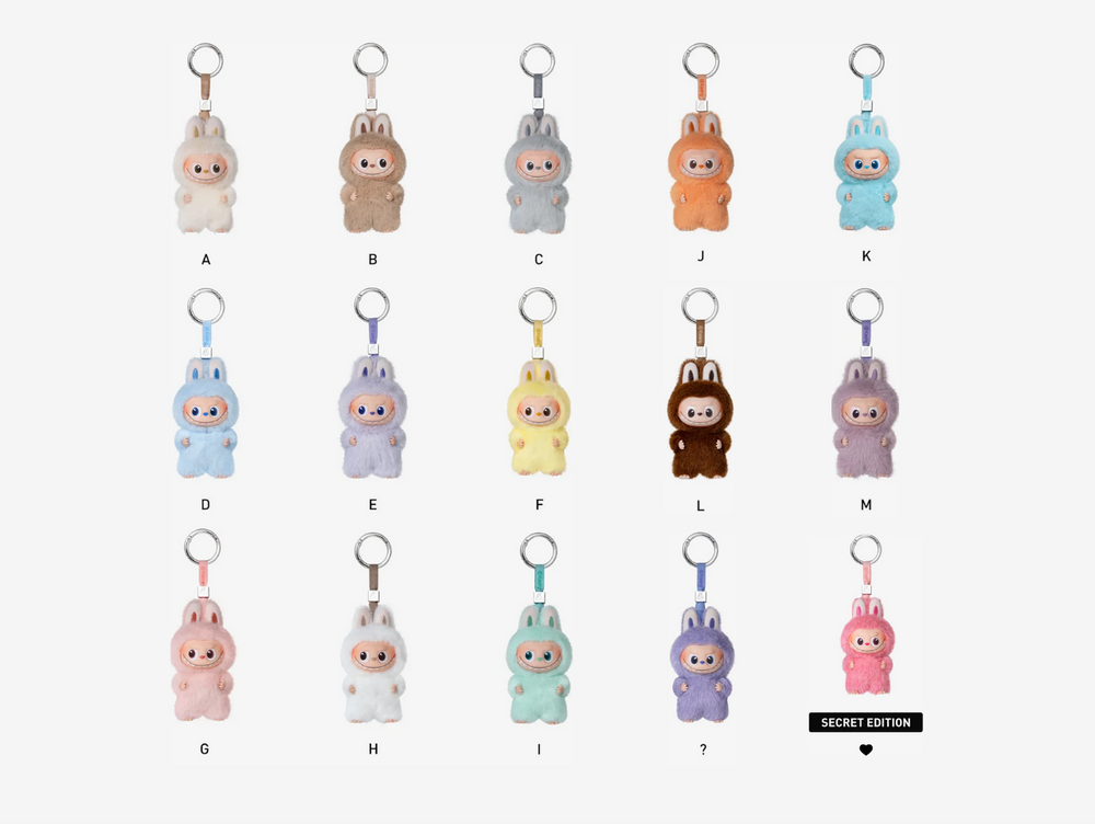 This Pop Mart Labubu The Monsters: Pin For Love Set includes a sealed collection of 14 blind-box plush pendant keychains — from letters A through M — each featuring the mischievous Labubu character rendered in a soft plush exterior and durable vinyl shell. Designed to clip onto bags, keys, or phone straps, each pendant carries its own unique personality and charm, encapsulating the playful love-letter motif of the series.