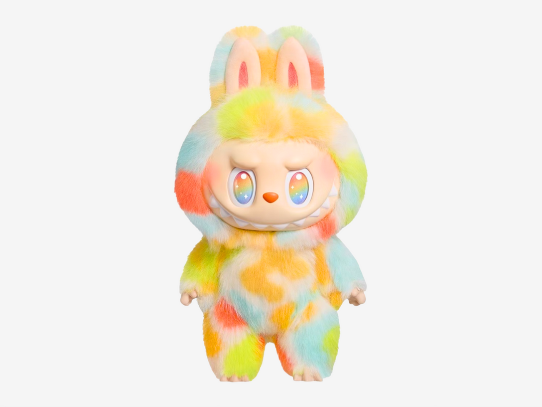The Labubu “Rock the Universe” doll from Pop Mart’s Big into Energy series is a collectible plush standing about 37 cm tall, crafted with long, soft fur in a vibrant tie-dye finish that makes each piece unique. Unlike the usual blind-box figures, this edition introduces a premium plush design and comes with an exclusive heart-shaped pearl pendant inscribed with “Monsters,” adding a signature detail.