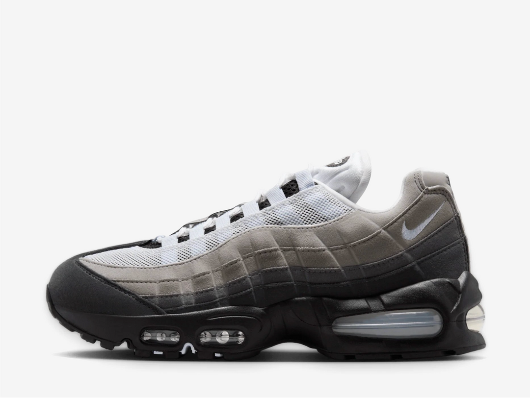 The signature layered upper blends suede and mesh in a smooth gradient from light grey to baby blue, complemented by icy "Blue Tint" detailing on the lace loops, tongue overlay, and mesh panels. A mini embroidered Swoosh hits the heel, while the crisp white lining adds to the clean, cooling aesthetic. Underfoot, Nike brings back its classic Big Bubble Air unit, originally shelved in the '90s but now a fan-favourite retro upgrade offering both comfort and heritage.
