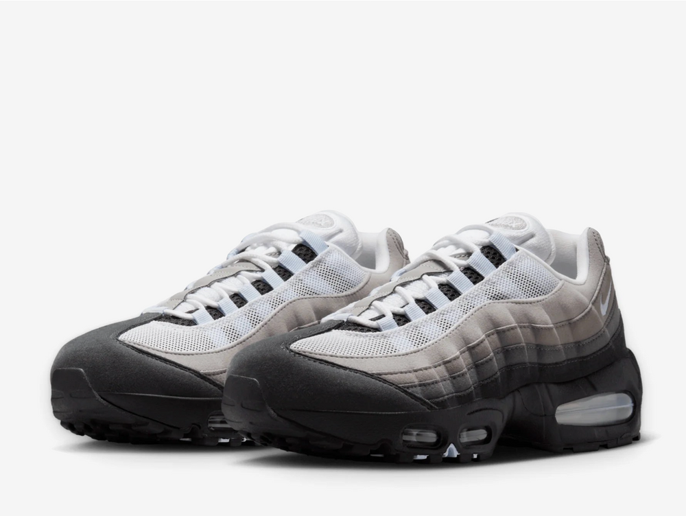 The signature layered upper blends suede and mesh in a smooth gradient from light grey to baby blue, complemented by icy "Blue Tint" detailing on the lace loops, tongue overlay, and mesh panels. A mini embroidered Swoosh hits the heel, while the crisp white lining adds to the clean, cooling aesthetic. Underfoot, Nike brings back its classic Big Bubble Air unit, originally shelved in the '90s but now a fan-favourite retro upgrade offering both comfort and heritage.