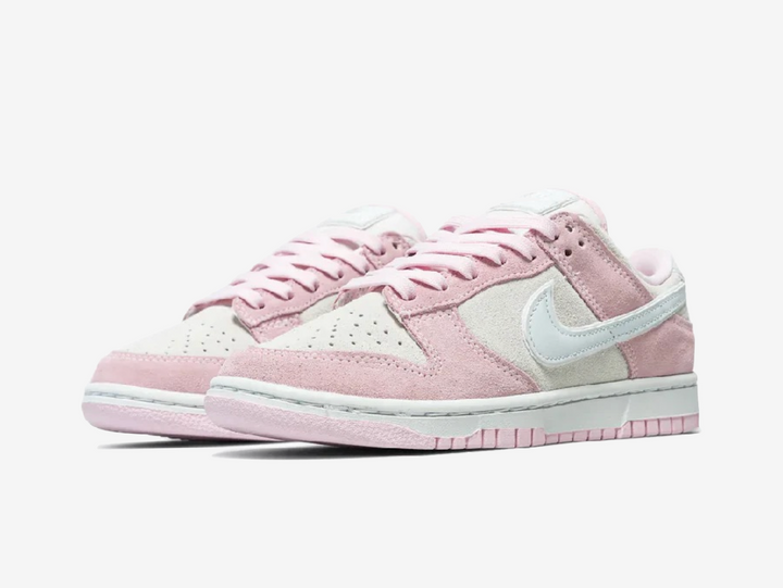Classic Nike Dunk shoes with a white and pink colourway.