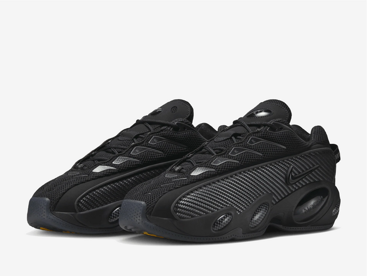 This colourway has an all-black mesh base with a woven textile mudguard as reinforcement. The highlight of this pair goes to the eyestay that spells out “Nike” and the bug-eyed midsole design flaunting carbon fibre textures. Swooshes on the sides come in a stealthy black hue, blending with the rest of the blacked-out design. The carbon fibre midfoot shank plate and the G-TEK outsole complete this outdoor-inspired lifestyle silhouette.