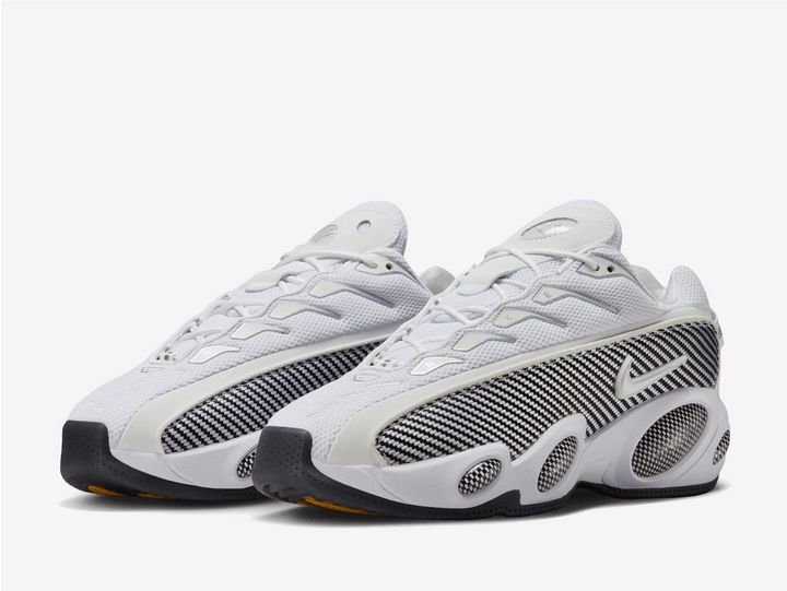 This latest edition sports a White/Black/University Gold colourway, echoing OG carbon-fibre styles from the mid-’90s. A mesh upper keeps it breathable, while those signature “bug-eye” pods along the sculpted foam midsole bring instant throwback energy. The black-and-white grid overlay channels the vibe of Penny Hardaway-era hardwood heat, with hits of gold underfoot giving it that final NOCTA flourish.