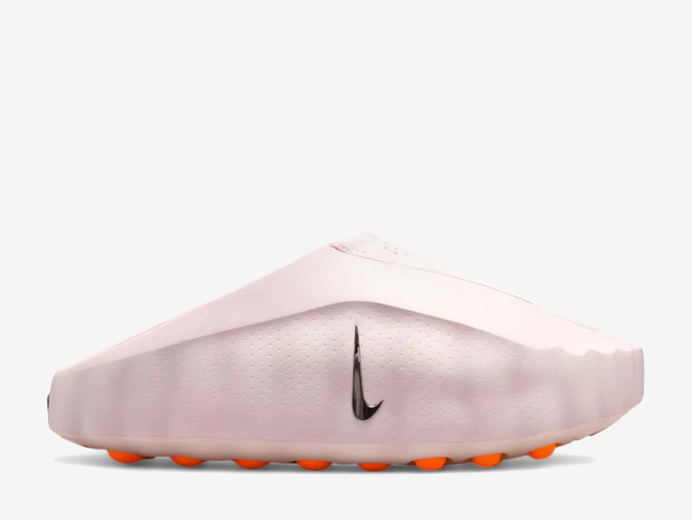 Born from the experimental Mind series, the Mind 001 "Pearl Pink" blends sensory innovation with sleek slip-on design in a soft pastel refresh. The moulded upper delivers a clean, minimalist shape with perforations across the vamp revealing glowing interior details, while a small metallic Swoosh at the midfoot adds subtle contrast. Built with neuroscience-inspired design at its core, the standout podded outsole features bright orange nodes arranged in a grid layout, creating gentle stimulation underfoot.