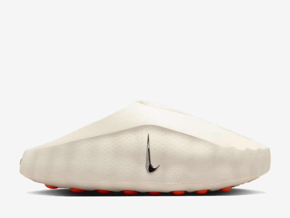Built with sculptural minimalism in mind, the design refuses to overcomplicate. Subtle perforations let your feet breathe, while minimal branding on the footbed keeps the focus where it belongs. Below, 22 vivid orange pods spike the outsole in Hyper Crimson, delivering traction with theatre and grounding the avant garde silhouette in something wearable, functional and unmistakably Nike.