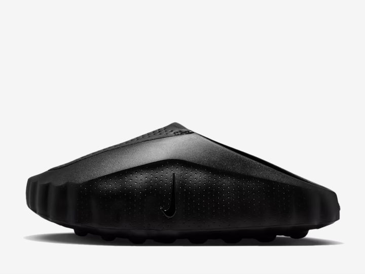 Black covers every surface, from the columned side panels to the perforated tongue and smooth upper, creating a seamless monochrome canvas. The raised side structure and moulded textures remain the focal points, while the 22 underfoot nodes blend into the build rather than demand attention. Pressed logos on the tongue and subtle vertical Swooshes keep branding whisper quiet, making this a silhouette for those drawn to design over decoration.