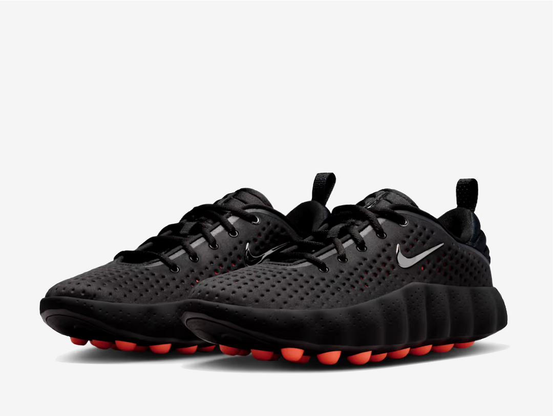 This 002 dons a black knitted textile upper with engineered perforations for a lightweight and breathable feel. A metallic silver Swoosh rests on the padded tongue and sidewall, complementing the chromed-out Nike branding on the rear. The traditional lacing system and puffy heel counter provide a secure fit. The chunky foam midsole delivers excellent cushioning and impact absorption underfoot. 22 spherical orange foam nodes target your foot’s pressure points, offering a mind-altering experience.