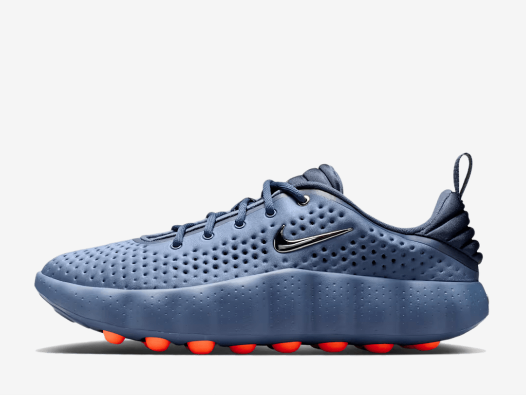Thunder blue tones cascade across the knit upper, accented with diffused blue and flashes of hyper crimson that catch the light with every stride. Breathable perforations keep things cool, while responsive foam cushioning and sensory nodes work beneath your feet to activate the brain and connect you to your surroundings. Whether navigating city streets or finding your flow, this is footwear that moves with purpose.