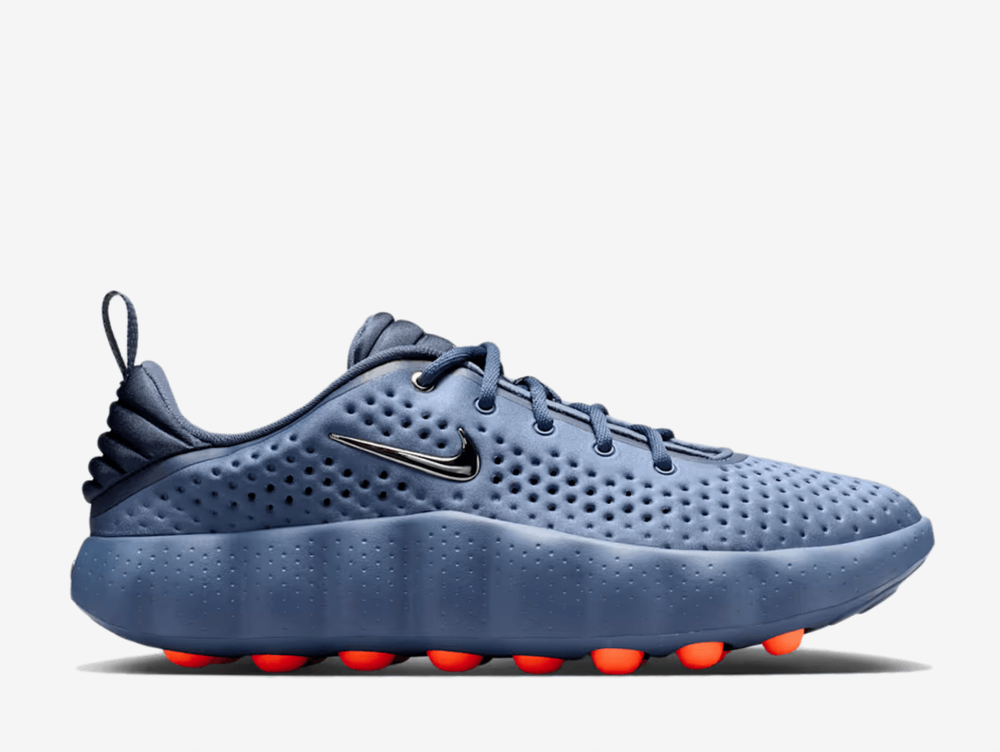 Thunder blue tones cascade across the knit upper, accented with diffused blue and flashes of hyper crimson that catch the light with every stride. Breathable perforations keep things cool, while responsive foam cushioning and sensory nodes work beneath your feet to activate the brain and connect you to your surroundings. Whether navigating city streets or finding your flow, this is footwear that moves with purpose.