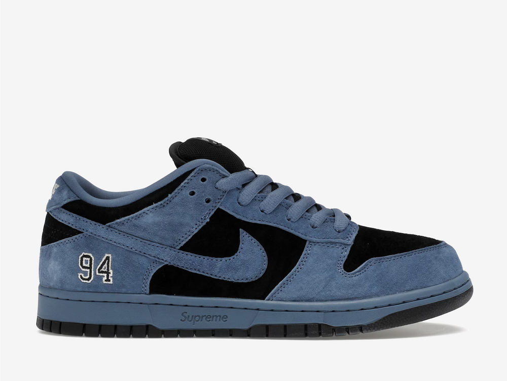 This special-edition skate shoe flaunts a two-tone palette, kitted in beige suede underlays with blue velvet overlays. Dark blue Swooshes grace the sidewalls, whilst the vibrant orange inner lining, a shared detail across all three colourways, contrasts the predominantly cool-coloured sneaker. An engraved Supreme label adorns the midsole, complementing the embroidered “94” on the lateral foxing. Co-branding on the tongue and sockliner set this exclusive SB apart.