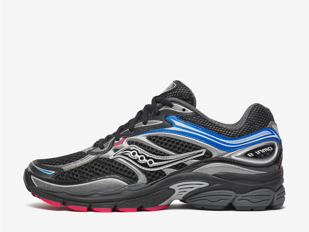 This pair features a breathable black open-mesh upper with metallic silver overlays for a sleek, performance-inspired look. Bright blue accents and subtle red detailing add bold contrast while maintaining everyday versatility. Underfoot, Saucony's ProGrid cushioning delivers reliable comfort and support, while a durable rubber outsole provides lasting grip and stability.