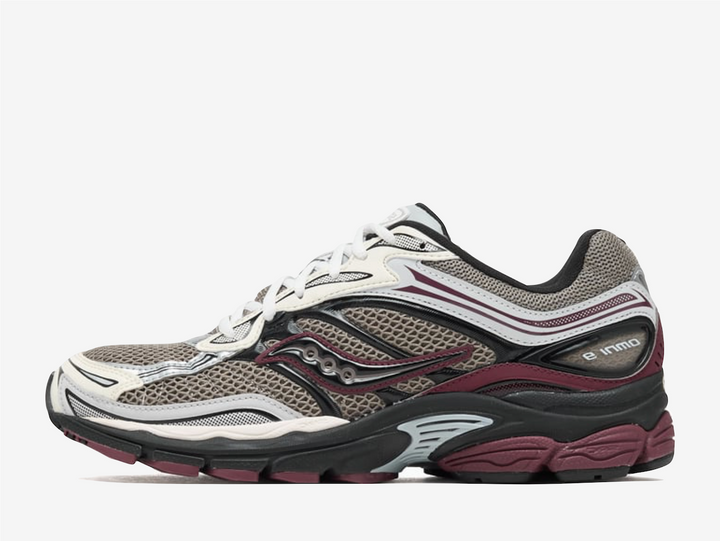 This sneaker, designed for men, showcases a striking beige and burgundy color palette that effortlessly complements its retro running aesthetic. Crafted with a combination of leather and rubber, the Saucony Progrid OMNI 9 is not just about looks; it embodies a harmonious balance of comfort and durability. The shoe's low profile enhances its sleek design, making it a perfect choice for those who appreciate both form and function in their footwear.
