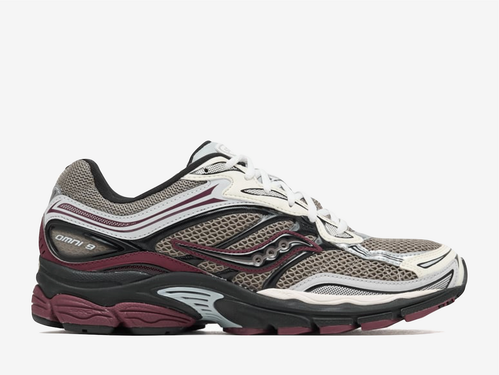 This sneaker, designed for men, showcases a striking beige and burgundy color palette that effortlessly complements its retro running aesthetic. Crafted with a combination of leather and rubber, the Saucony Progrid OMNI 9 is not just about looks; it embodies a harmonious balance of comfort and durability. The shoe's low profile enhances its sleek design, making it a perfect choice for those who appreciate both form and function in their footwear.