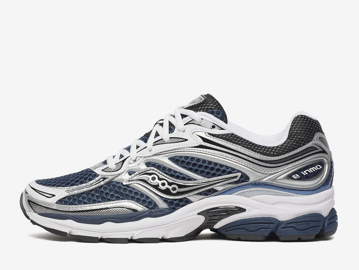 The Saucony ProGrid Omni 9 in Deep Navy delivers responsive cushioning and reliable stability for everyday running. Built with ProGrid technology, this shoe provides impact protection and energy return with each stride. The durable rubber outsole ensures traction across varied surfaces, while the breathable mesh upper keeps your foot cool during extended wear. A classic silhouette that balances performance with versatility, making it an excellent choice for runners seeking dependable comfort.