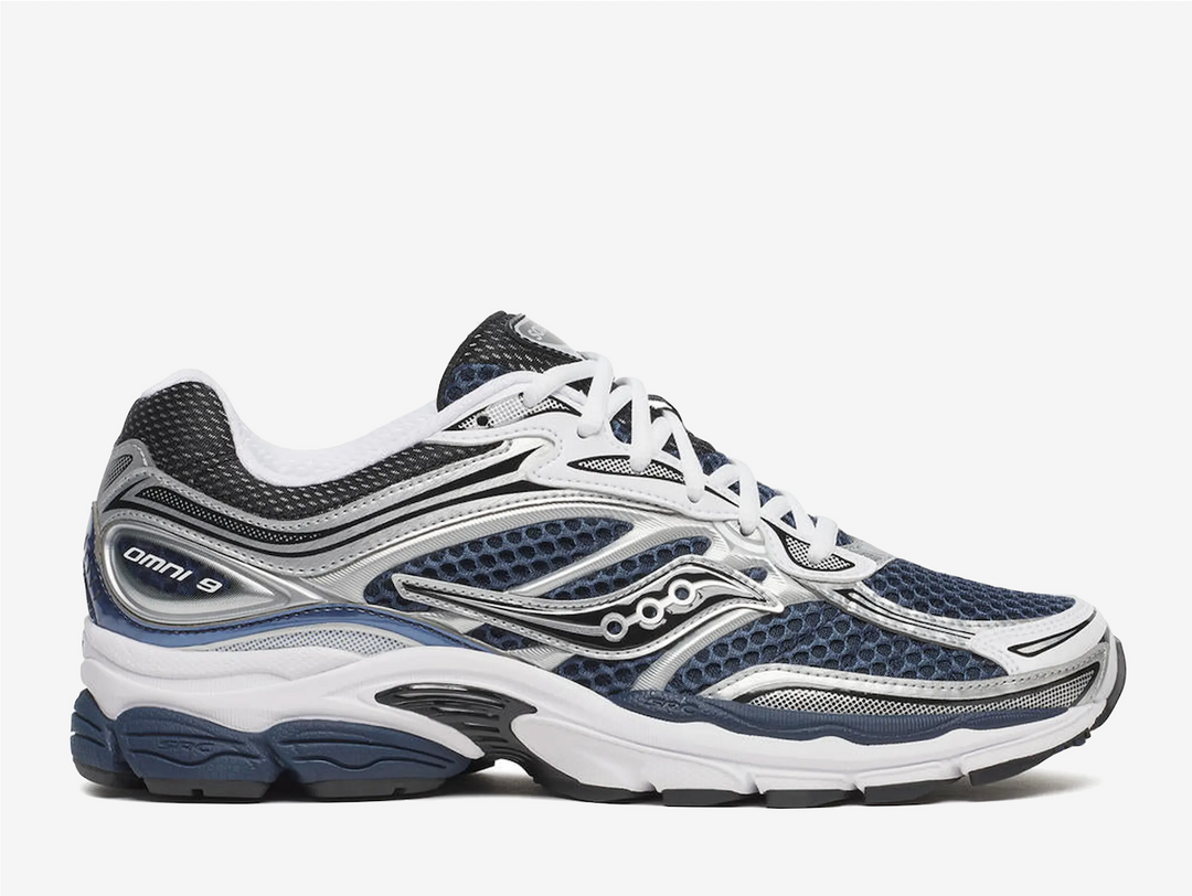 The Saucony ProGrid Omni 9 in Deep Navy delivers responsive cushioning and reliable stability for everyday running. Built with ProGrid technology, this shoe provides impact protection and energy return with each stride. The durable rubber outsole ensures traction across varied surfaces, while the breathable mesh upper keeps your foot cool during extended wear. A classic silhouette that balances performance with versatility, making it an excellent choice for runners seeking dependable comfort.