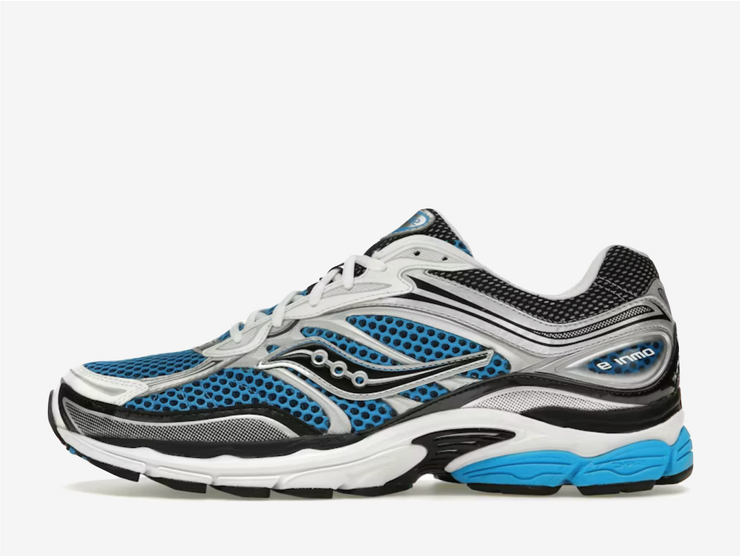 The Saucony Omni 9 “Royal Silver” blends running heritage with a clean, modern look. Breathable mesh is paired with metallic silver overlays and royal blue accents for a standout yet wearable finish. Supportive cushioning and a structured midsole provide all-day comfort and stability, making it ideal for both movement and everyday wear.