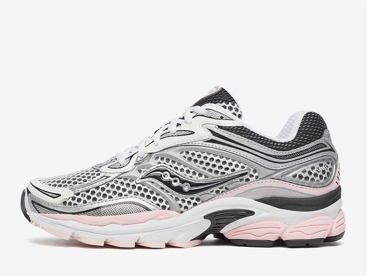 The Saucony ProGrid Omni 9 Silver Pink balances technical design with playful contrast by pairing metallic silver with soft pink accents. The result feels approachable yet expressive, letting the silhouette’s layered construction shine while color adds personality. It highlights the ProGrid Omni 9 as a bridge between archival running function and contemporary lifestyle appeal.