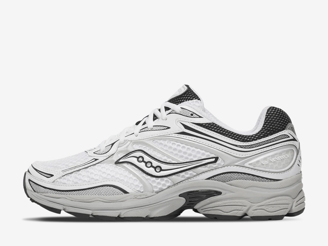 Saucony ProGrid Omni 9 trainers in the White Cadet colourway, featuring breathable white mesh uppers, metallic silver overlays, navy blue detailing, classic Saucony branding and a cushioned retro running sole.