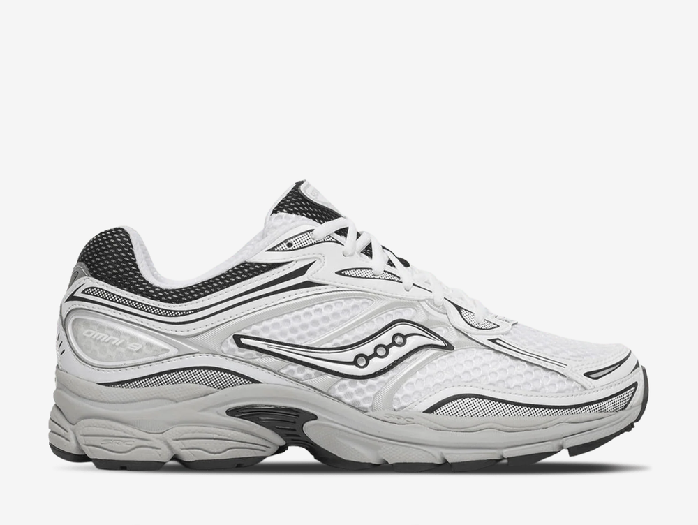 Saucony ProGrid Omni 9 trainers in the White Cadet colourway, featuring breathable white mesh uppers, metallic silver overlays, navy blue detailing, classic Saucony branding and a cushioned retro running sole.