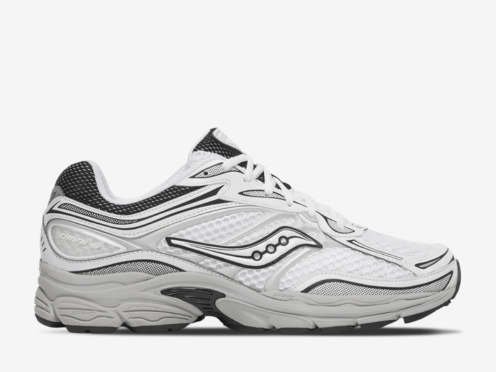 Saucony ProGrid Omni 9 trainers in the White Cadet colourway, featuring breathable white mesh uppers, metallic silver overlays, navy blue detailing, classic Saucony branding and a cushioned retro running sole.