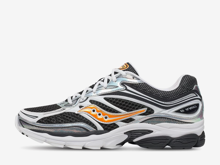 The White Black Orange colourway features a clean white base with black overlays and bright orange accents throughout, creating a sharp contrast with a sporty edge. Finished with classic Saucony branding and a cushioned sole, the Saucony ProGrid Omni 9 Speed Shades White Black Orange blends retro performance heritage with standout everyday styling.