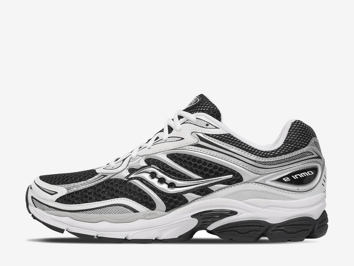 The Black White colourway features a sharp black base contrasted with clean white overlays and Saucony branding, creating a bold yet versatile look with strong Y2K running influence. Finished with breathable mesh construction and responsive cushioning underfoot, the Saucony ProGrid Omni 9 Black White blends retro performance heritage with modern everyday styling.