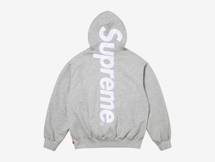 The Supreme Appliqué Logo Hoodie in Grey offers a clean, versatile look with soft, heavyweight fleece for steady comfort. The appliqué Supreme logo across the chest adds texture and a strong focal point without feeling loud. A roomy hood, kangaroo pocket, and ribbed trims keep the fit secure and easy to wear. The neutral grey colorway pairs well with almost anything, making this hoodie a dependable choice for anyone who wants classic Supreme style with refined detail.