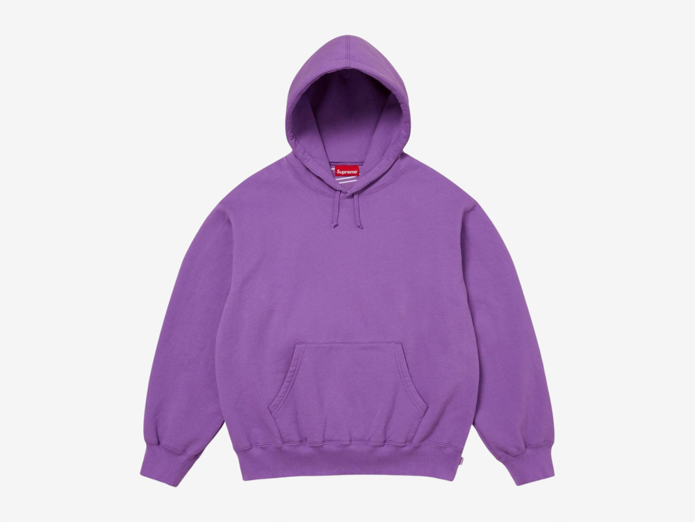 The Supreme Appliqué Logo Hoodie in Purple stands out with a bold, saturated color paired with soft, heavyweight fleece for steady comfort. The appliqué Supreme logo across the chest adds textured detail that complements the vibrant tone. The hood, kangaroo pocket, and ribbed trims keep the fit reliable and easy to wear. The purple colorway gives this piece a confident edge, ideal for anyone looking for a Supreme hoodie with strong personality.