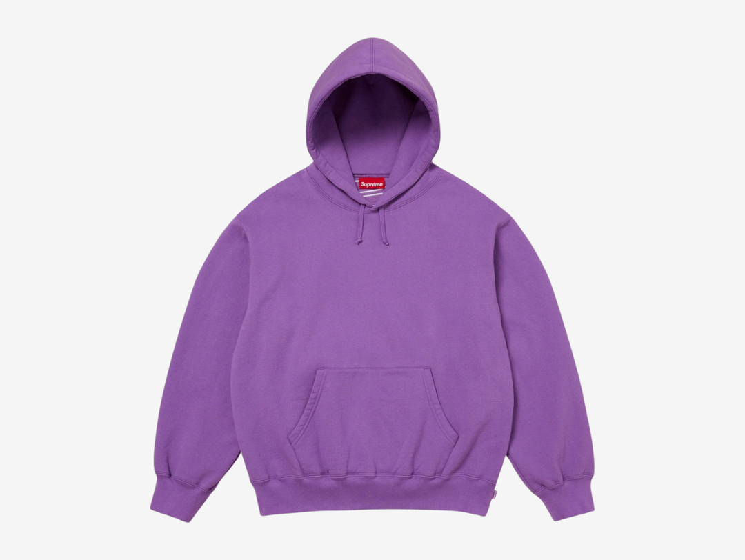 The Supreme Appliqué Logo Hoodie in Purple stands out with a bold, saturated color paired with soft, heavyweight fleece for steady comfort. The appliqué Supreme logo across the chest adds textured detail that complements the vibrant tone. The hood, kangaroo pocket, and ribbed trims keep the fit reliable and easy to wear. The purple colorway gives this piece a confident edge, ideal for anyone looking for a Supreme hoodie with strong personality.