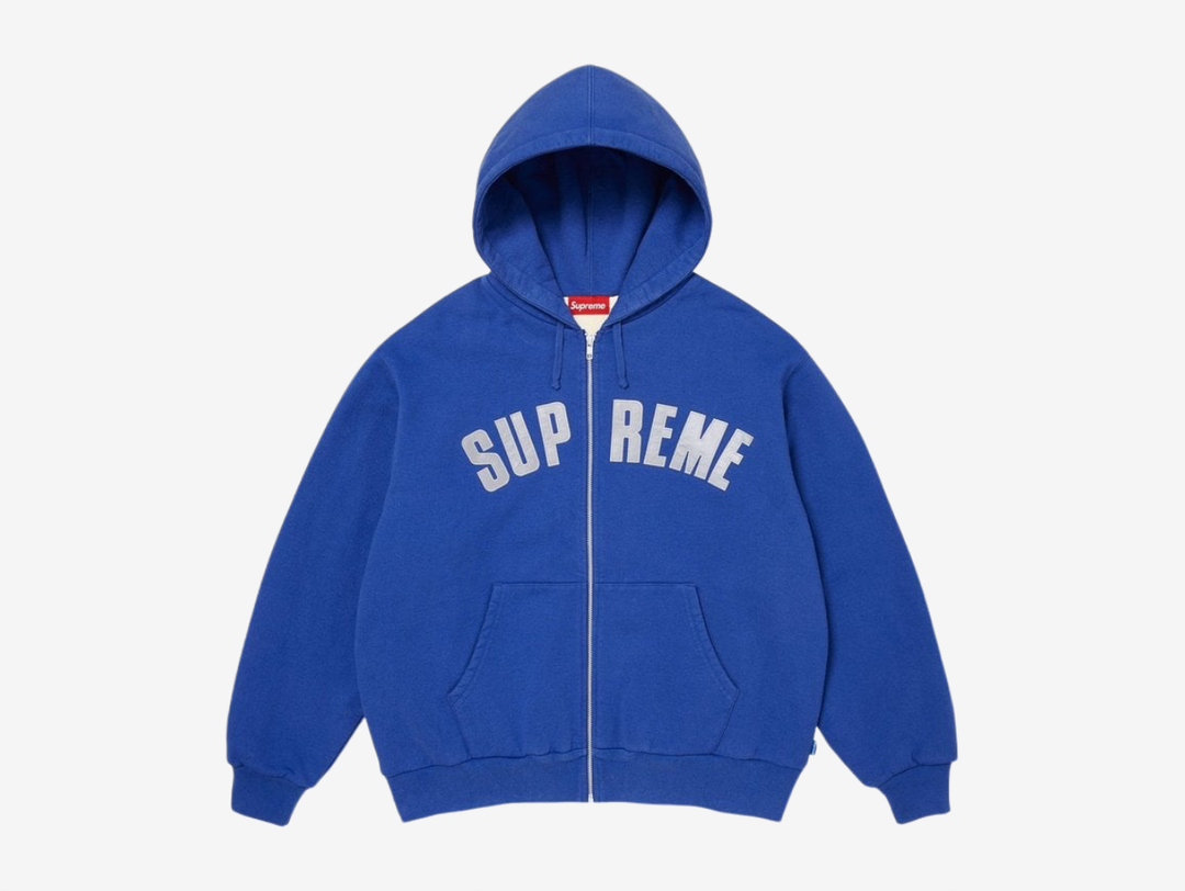 The Supreme Arc Logo Thermal Lined Zip Up Hoodie is crafted from heavyweight crossgrain brushed-back fleece for a substantial, premium feel. A cotton waffle thermal lining adds extra warmth and structure, making it ideal for colder weather without losing the classic Supreme hoodie shape. Finished with a full zip closure, front pouch pockets and a tackle twill Arc Logo appliqué across the chest, the design keeps the branding bold while staying rooted in a clean, everyday silhouette.