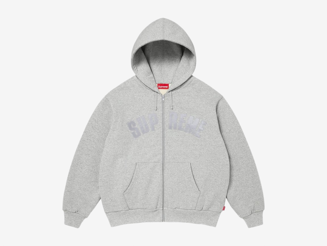 The Supreme Arc Logo Thermal Lined Zip Up Hoodie is crafted from heavyweight crossgrain brushed-back fleece for a substantial, premium feel. A cotton waffle thermal lining adds extra warmth and structure, making it ideal for colder weather without losing the classic Supreme hoodie shape. Finished with a full zip closure, front pouch pockets and a tackle twill Arc Logo appliqué across the chest, the design keeps the branding bold while staying rooted in a clean, everyday silhouette.