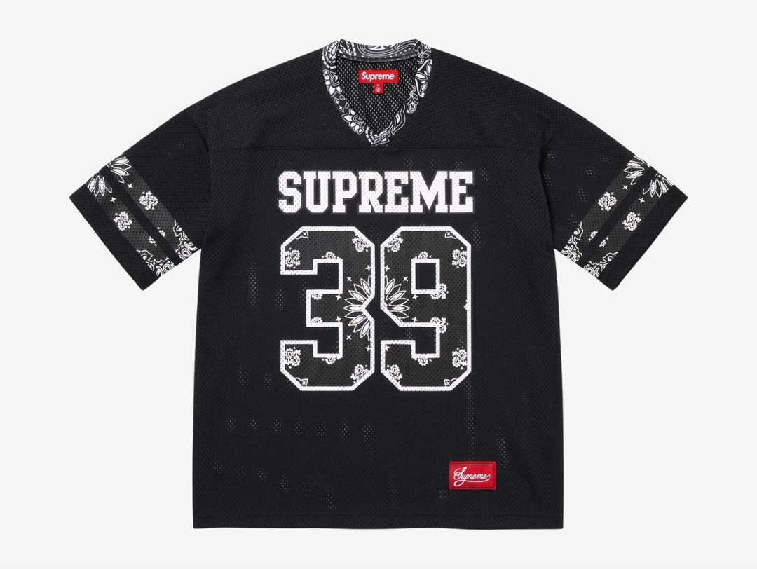 The Supreme Bandana Football Jersey Black fuses classic athletic design with the brand’s signature edge. Built on a breathable mesh base, the jersey is elevated with all-over bandana-inspired graphics that bring bold texture and street presence. Athletic striping and tackle-twill style branding nod to traditional gridiron uniforms, while the relaxed, boxy fit keeps it easy to layer. A statement piece that blends sport heritage with unmistakable Supreme attitude, built for both on- and off-duty wear.