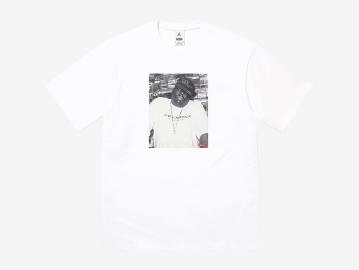 Crafted from soft, premium cotton, the Supreme x Jordan Biggie Tee 'White' delivers both comfort and standout style. The relaxed fit makes it ideal for casual wear, whether styled with jeans or layered under a jacket. Elevate your streetwear collection with this exclusive piece that celebrates the timeless connection between sport, music, and fashion. Don’t miss your chance to own this unique design that merges hip-hop heritage with Jordan’s basketball legacy.