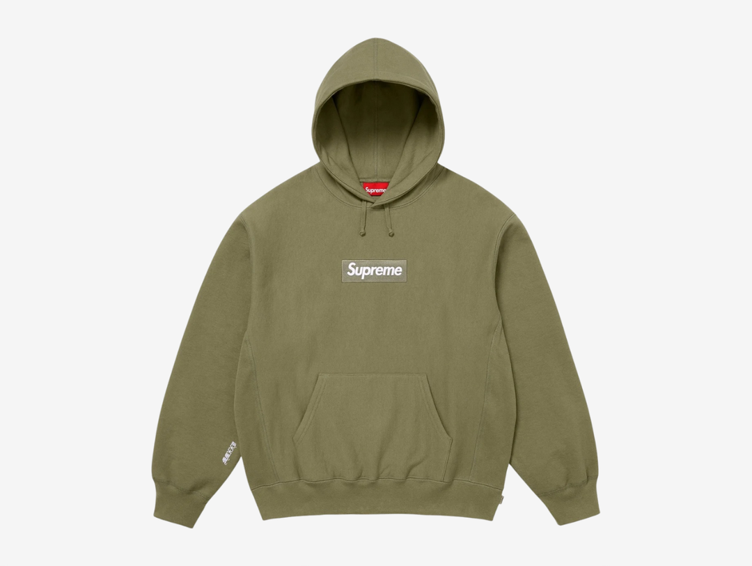 Made from heavyweight crossgrain brushed-back fleece, this Supreme Box Logo Hoodie offers superior warmth, structure, and durability with a soft interior feel. Ribbed gussets reinforce the design while allowing comfortable movement, and a classic pouch pocket adds everyday practicality. Finished with Supreme’s iconic embroidered box logo on the chest and an embroidered graphic on the sleeve, this hoodie delivers a clean, elevated take on a streetwear essential.