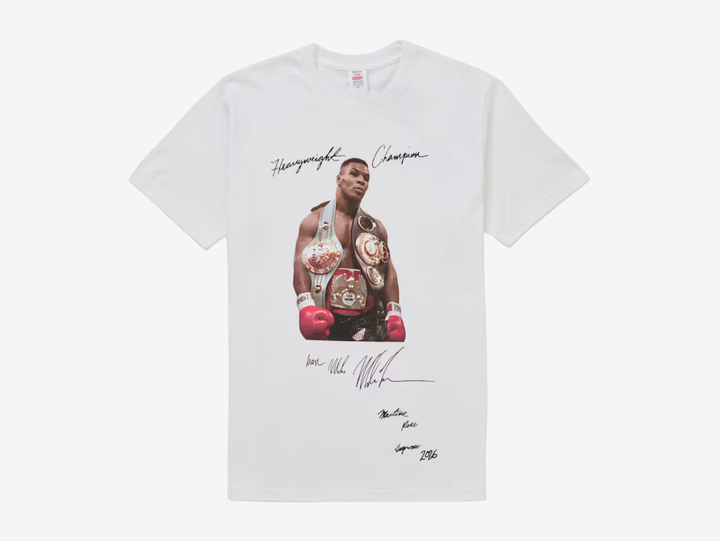 The Supreme Mike Tyson T-Shirt White features the iconic photographic Mike Tyson graphic across the front of a classic white cotton tee. A standout piece from Supreme’s archive, combining the brand’s signature photo-tee style with one of boxing’s most recognisable figures.