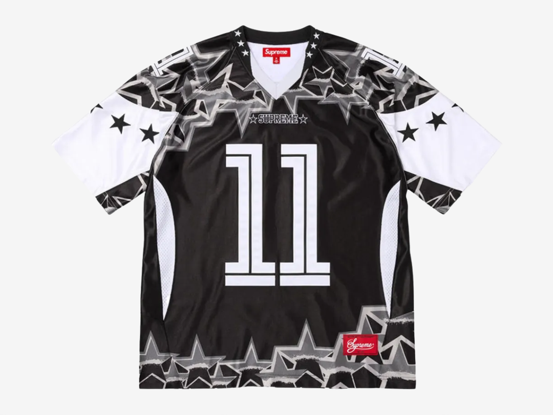 The Supreme Stars Football Jersey in Black and White delivers a clean athletic look with Supreme’s streetwear edge. Made from breathable, lightweight mesh, it features bold star detailing and contrast paneling that give it a classic jersey feel. The relaxed fit keeps it comfortable for daily wear while the sharp black and white colorway makes it easy to style. This piece works well for anyone who wants a sporty Supreme item with a strong visual presence.