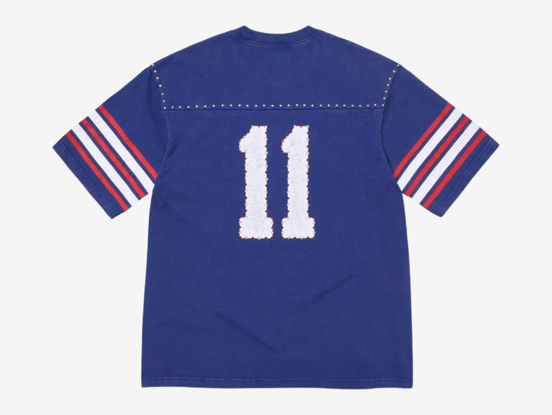 All cotton slub jersey crewneck with metal studs at yoke. Printed logo and graphic at front and back with rhinestone appliqué. Woven logo label at lower front.