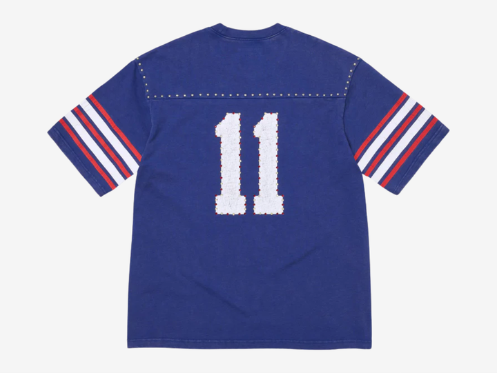 All cotton slub jersey crewneck with metal studs at yoke. Printed logo and graphic at front and back with rhinestone appliqué. Woven logo label at lower front.