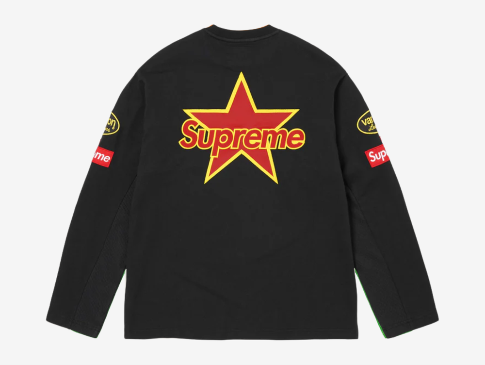 All cotton jersey with cotton mesh panels at chest and sleeves. Embroidered logo patches on chest and sleeves. Embroidered graphics on front and printed graphics on sleeves. Embroidered logo appliqué at back.